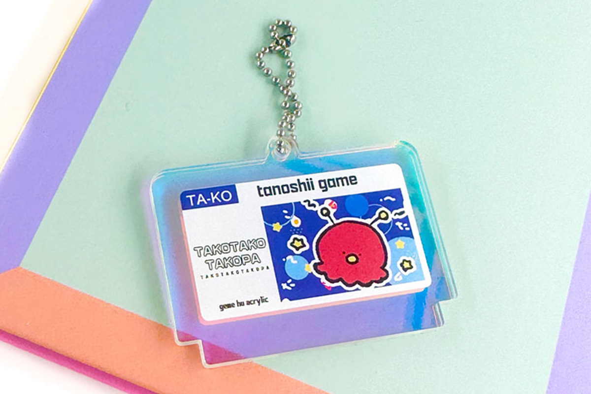 ME-Q、オリジナルプリントの「ゲームカセット風キーホルダー」を1個